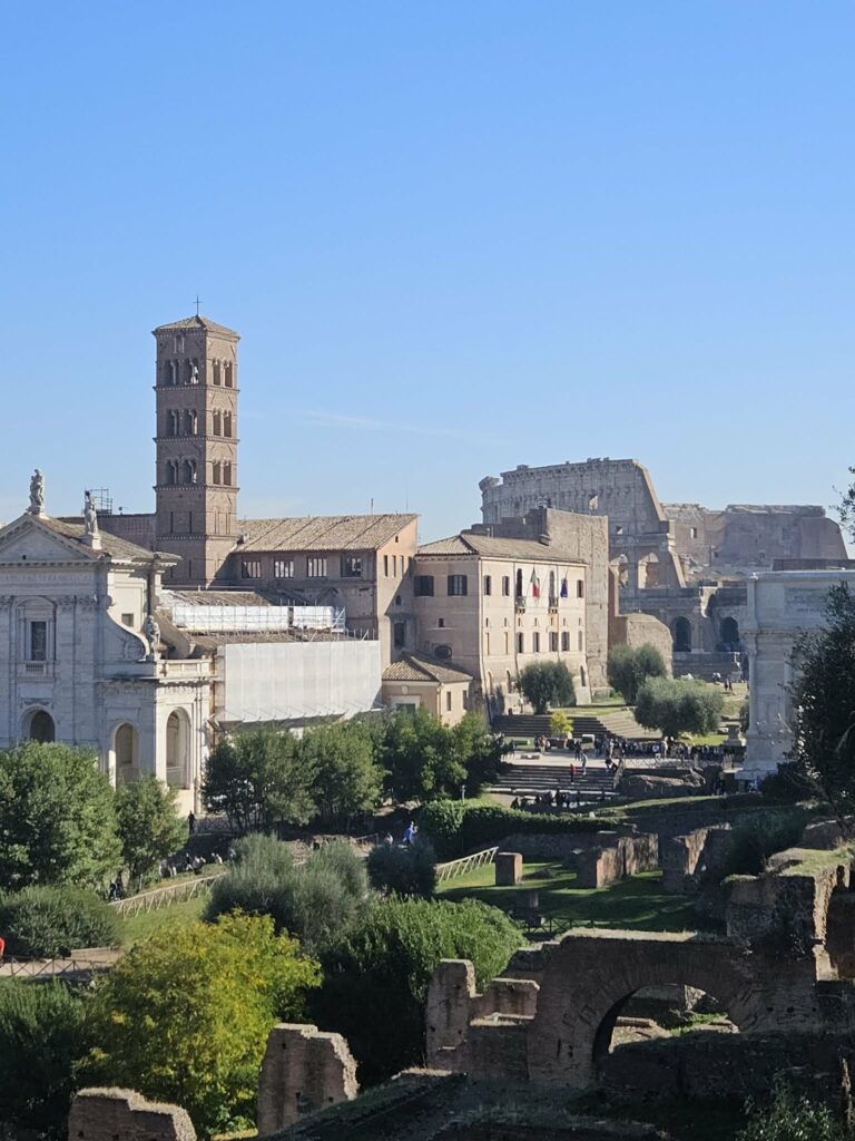 View across the Roman Forum showing ruins and historic buildings in Rome.